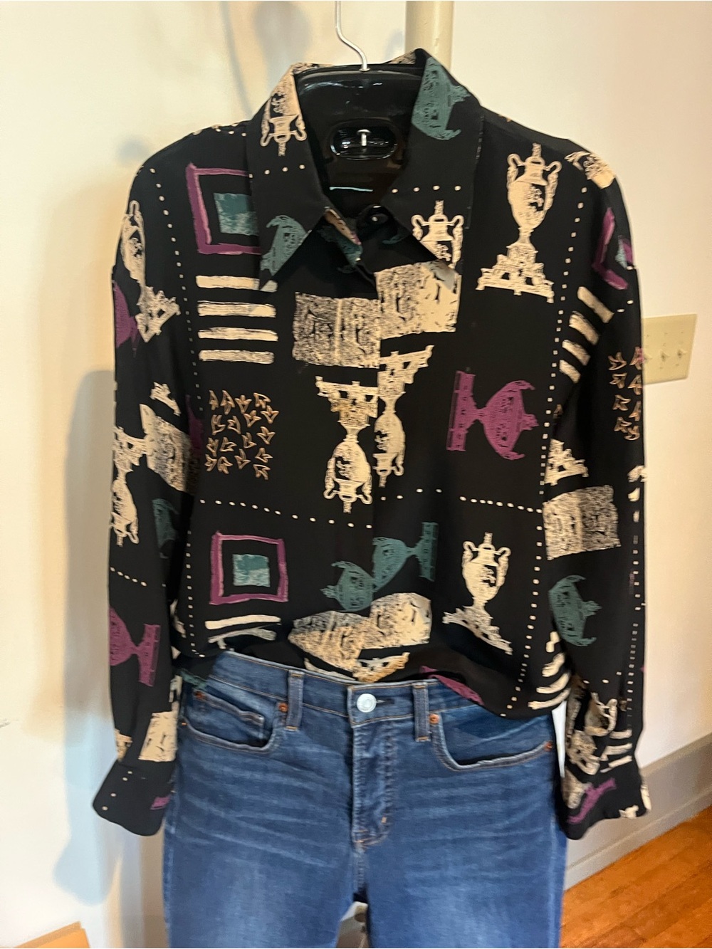100% silk vintage TESS blouse with black background and repeating graphic print